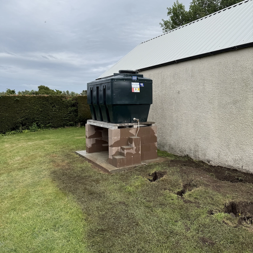 Corroded 1970s steel oil tank replaced with a modern plastic bunded tank