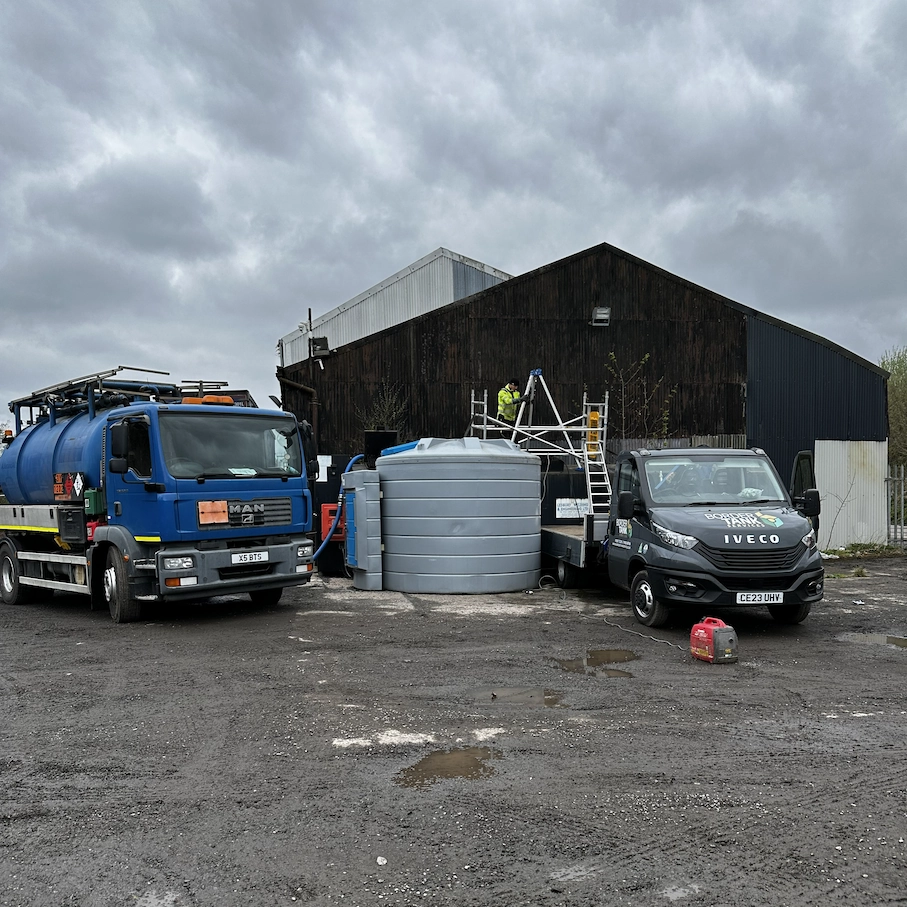 Border Tank Services engineer working on top of a large storage tank
