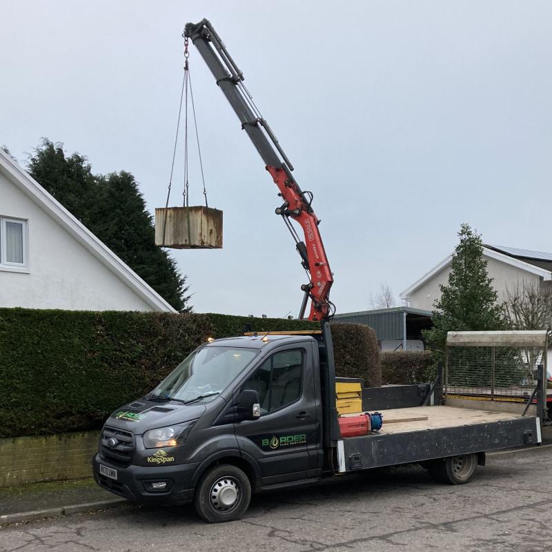 Oil tank being safely removed from a domestic property