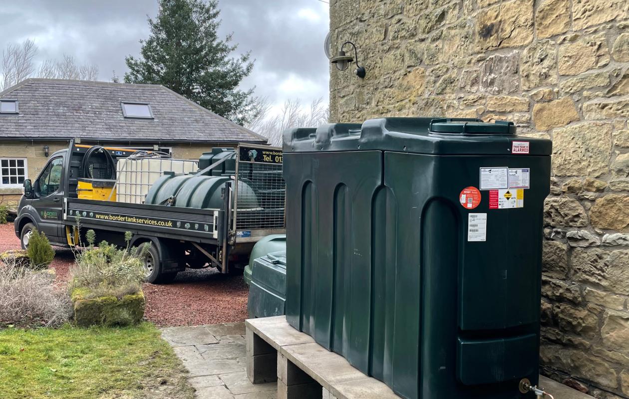 Border Tank Services engineer replacing a domestic oil tank
